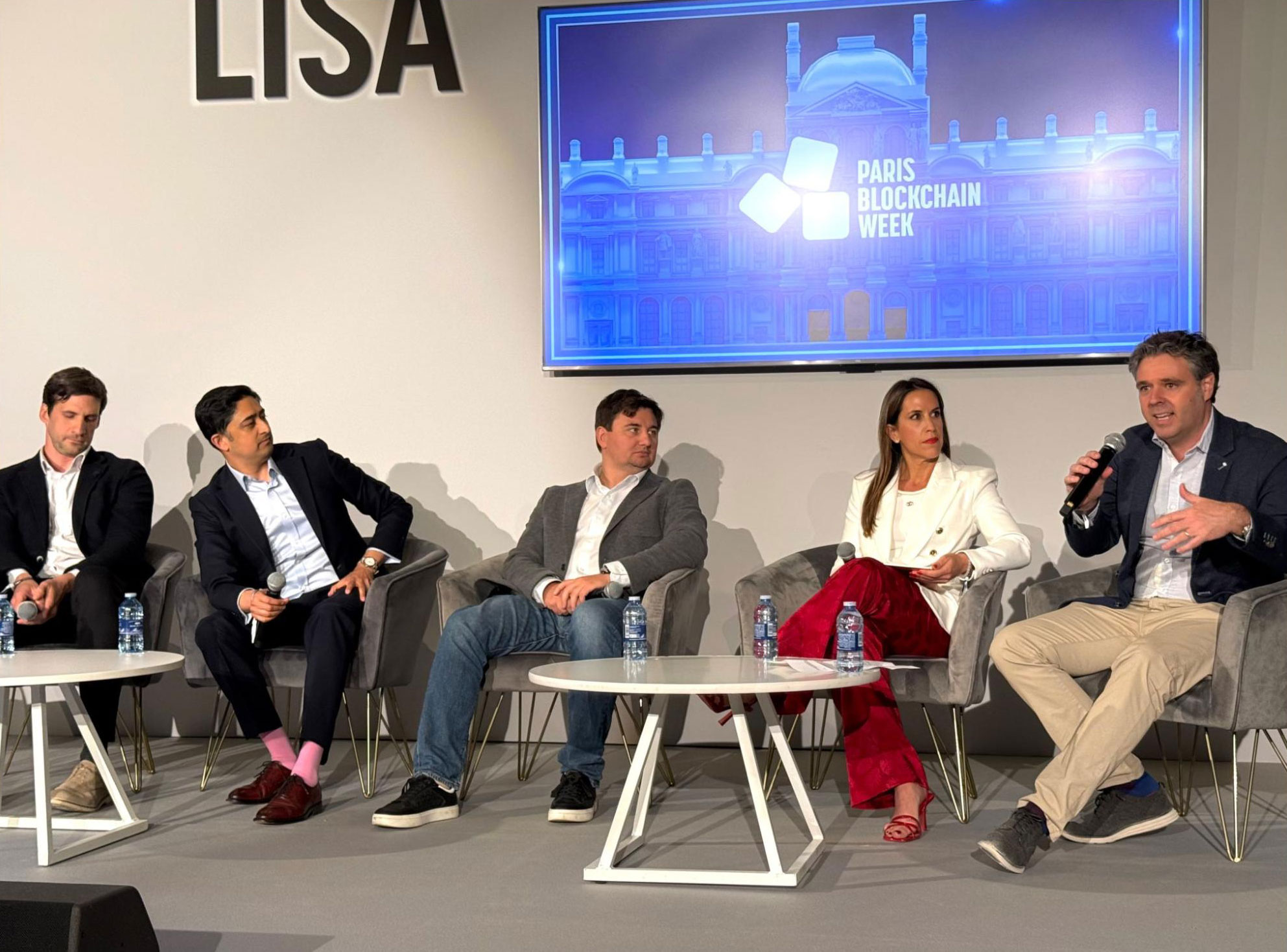 Lex Fisun, CEO at Global Ledger, at Paris Blockchain Week 2026 — pictured center